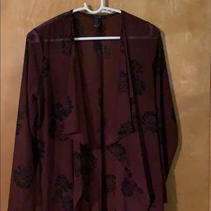 Sheer long flowing burgundy top.